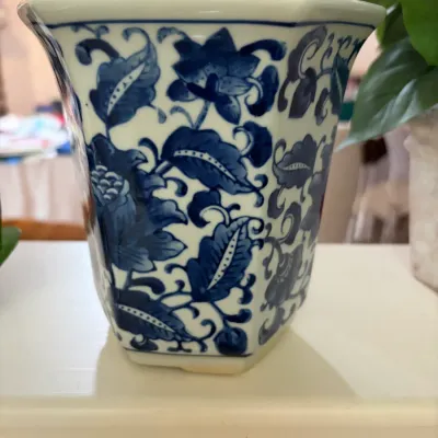 Sale Photo Thumbnail #66: Hexagonal blue and white ceramic planter featuring a Chinoiserie floral and leaf motif.