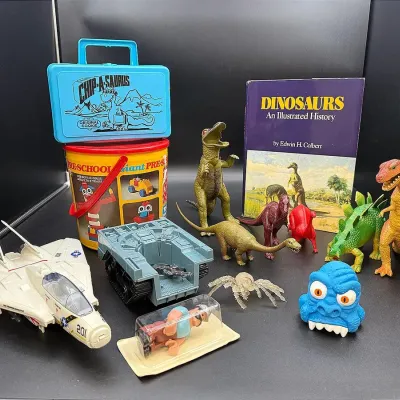 Vintage 1980’s Toy Lot Featuring An Original Cookie Co Pencil Box And A 1989 Hasbro Flying Fighter 