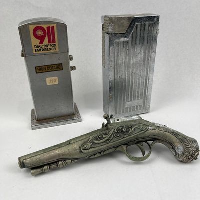 Sale Photo Thumbnail #399: Trio Vtg Flintlock & Gas Pump Lighters