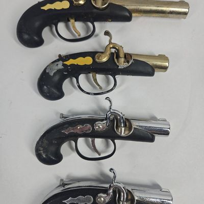 Sale Photo Thumbnail #243: A Group of Novelty Pistol Lighters