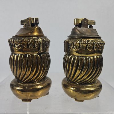 Sale Photo Thumbnail #175: Pair Evans USA Gilt Cast Table Lighters
