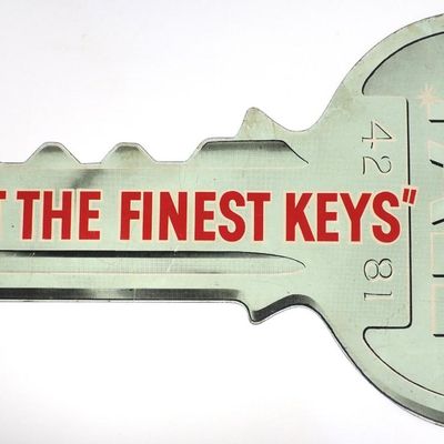 Sale Photo Thumbnail #377: Yale "We Cut The Finest Keys" key-shaped sign