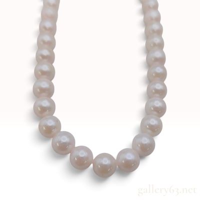 Sale Photo Thumbnail #617: A Cultured Pearl and Silver Single Strand Necklace
