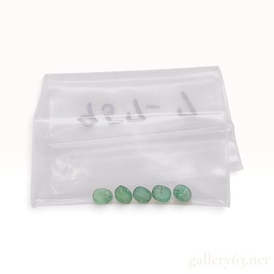 Sale Photo Thumbnail #629: A Set of Five Green Oval Cabochon Gemstones Appearing to be Emerald