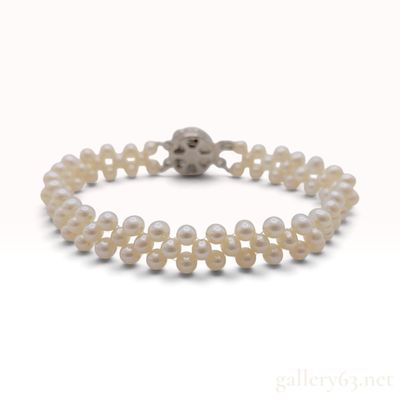 Sale Photo Thumbnail #290: A Vintage Silver Triple-Strand Woven Pearl Bracelet