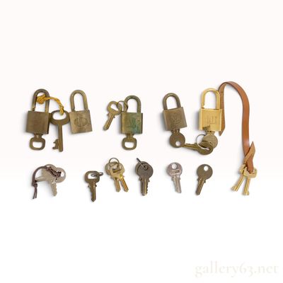 Sale Photo Thumbnail #486: A Collection of Louis Vuitton Dunhill and Alpha Brass Padlocks and Keys