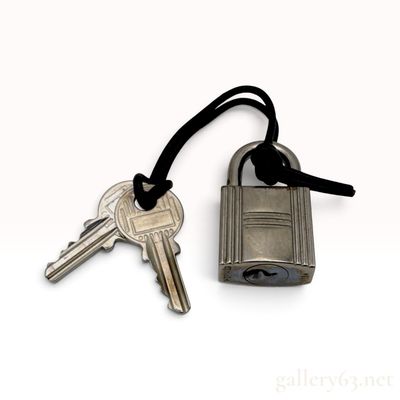 Sale Photo Thumbnail #513: Hermes Silvertone Palladium Plated Padlock and Key Set 124