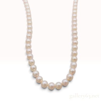 Sale Photo Thumbnail #605: A Vintage Cultured Pearl Strand Necklace with Silver Floral Clasp