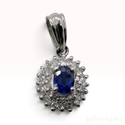 Sale Photo Thumbnail #436: 14 Karat White Gold 0.90ct Sapphire and 0.11ctw Natural Diamond Halo Pendant