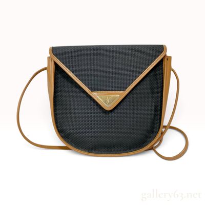 Sale Photo Thumbnail #212: Vintage Yves Saint Laurent Black Textured and Tan Leather Saddle Crossbody Bag