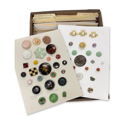 A LARGE BOX LOT OF CARDED MATERIAL BUTTONS