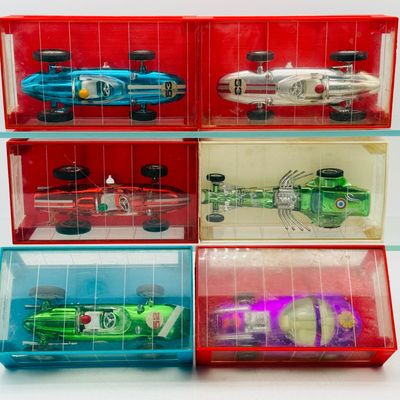 A Set of 6 Zee Toys Monaco Race Cars in Garages