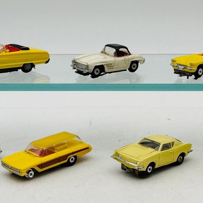 Seven Vintage Lionel, Atlas and Aurora HO Scale Slot Cars
