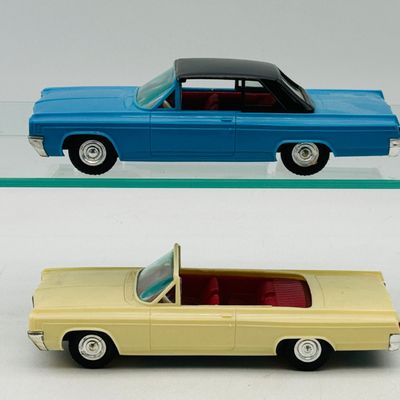 2 1963 Oldsmobile Starfire Plastic Friction Toy Cars