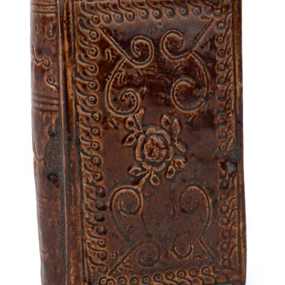 Rockingham-Glazed Figural Book Flask with Sprigged and Incised Decoration
