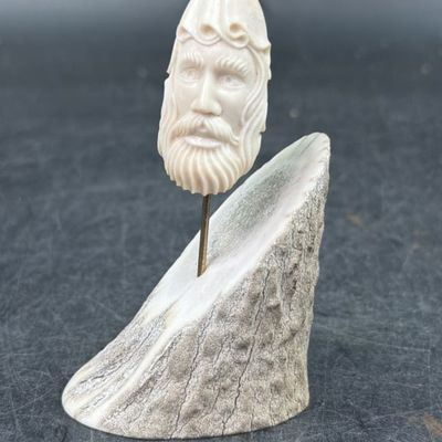 Carved Walrus Tooth with an Antler Base.