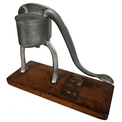 Sale Photo Thumbnail #215: Old Manual Hand Press Citrus Juicer by Hammacher