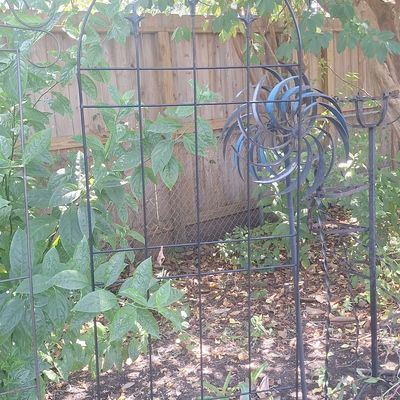 Sale Photo Thumbnail #120: Wrought Iron Garden Trellis with Kinetic Wind Spinner