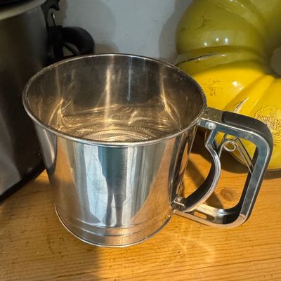 Sale Photo Thumbnail #995: Vintage Stainless Steel Squeeze Handle Flour Sifter