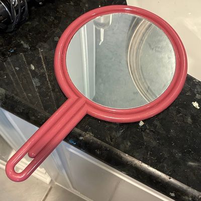 Sale Photo Thumbnail #972: Vintage Pink Plastic Hand Mirror