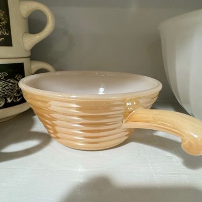 Sale Photo Thumbnail #746: Fire-King Peach Luster Beehive Handled Soup Bowl