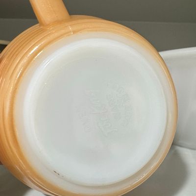 Sale Photo Thumbnail #749: Fire-King Peach Luster Beehive Handled Soup Bowl