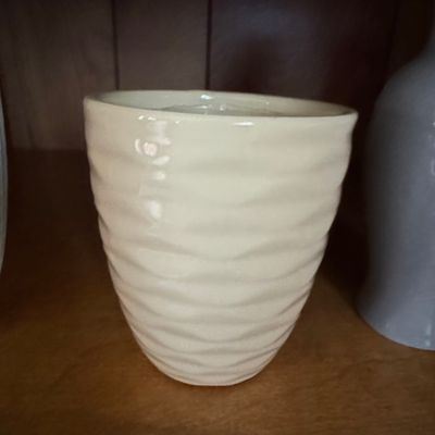 Sale Photo Thumbnail #843: Cream-Colored Wavy Ribbed Ceramic Footed Planter
