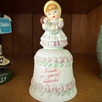 Sale Photo Thumbnail #937: Homco #1416 Porcelain Bell - Girl Holding Doll