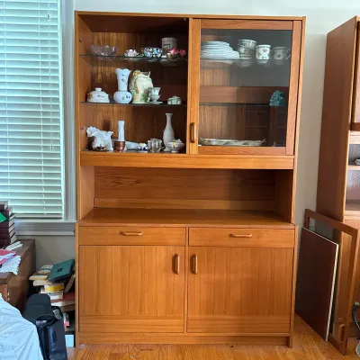 DANISH MODERN TEAK TWO-PIECE HUTCH AND DISPLAY CABINET
The two-piece hutch is constructed with a teak veneer and features an upper...