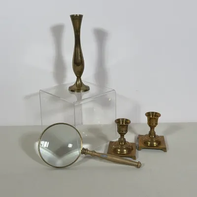 (4pc) INDIAN & OTHER BRASS CANDLESTICKS & MAGNIFYING GLASS
Four-piece collection of solid brass items including a magnifying...