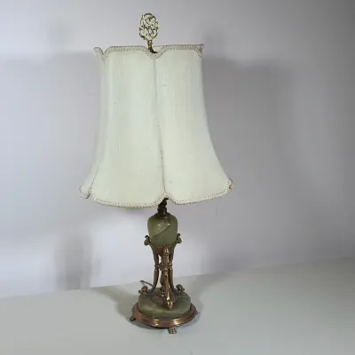 NEOCLASSICAL STYLE GREEN ONYX AND GILT METAL TABLE LAMP
The table lamp features a green onyx orb and a circular onyx base set within a...