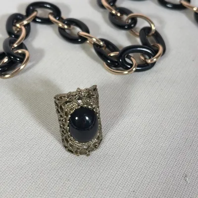 (4pc) GROUP OF ASSORTED COSTUME JEWELRY
Group includes two necklaces and two rings of various styles and finishes. One necklace features...
