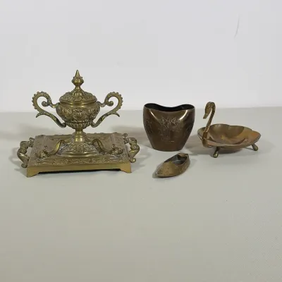 (4pc) VICTORIAN BRASS INKWELL STAND AND THREE BRASS MINIATURES
Four-piece lot featuring a footed brass inkwell stand with scroll handles...