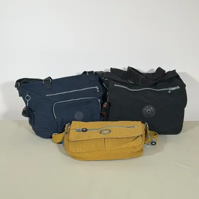 (3pc) TRIO OF KIPLING CRINKLED NYLON HANDBAGS
Set of three Kipling handbags crafted from signature crinkled nylon in navy blue, black,...