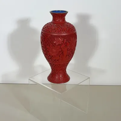CHINESE CINNABAR LACQUER VASE WITH FLORAL RELIEF
This Chinese cinnabar lacquer vase features high-relief carvings of peonies and...
