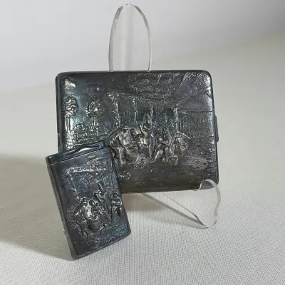 (2pc) DANISH SILVER PLATED CIGARETTE CASE AND MATCHBOX HOLDER
This silver-plated set consists of a hinged cigarette case and a sliding...