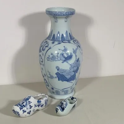 (3pc) CHINESE STYLE BLUE AND WHITE CERAMIC BALUSTER VASE AND TWO DELFTS BLAUW CLOGS
A blue and white glazed ceramic baluster vase...
