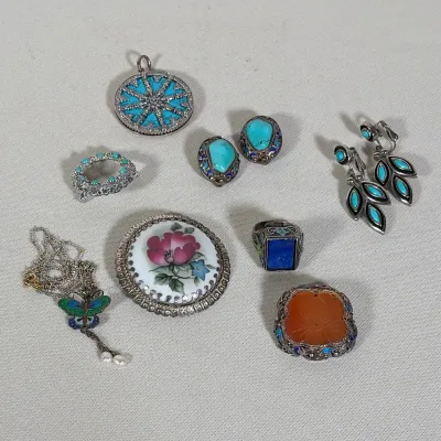 (10pc) COLLECTION OF ARTISAN AND CHINESE EXPORT STERLING SILVER JEWELRY
This eight-piece collection includes three brooches, two pairs of...