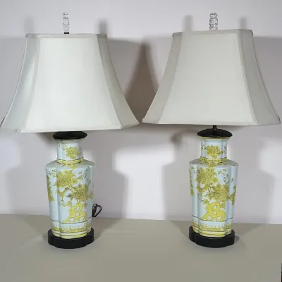 PAIR OF CHINOISERIE FLORAL CERAMIC TABLE LAMPS
Pair of ceramic table lamps featuring yellow floral and chrysanthemum motifs over a pale...