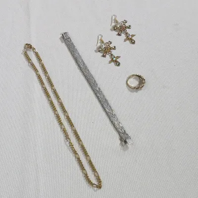 (3pc) ALEXANDER MCQUEEN EARRINGS, STERLING SILVER BRACELET, AND GOLD PLATED JEWELRY GROUP
This lot features a sterling silver woven link...