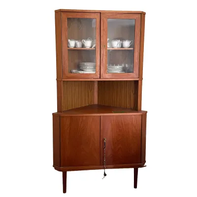 SCANDINAVIAN MODERN TEAK TWO-PART CORNER CABINET
This two-part corner cabinet is constructed from teak and features an upper section with...