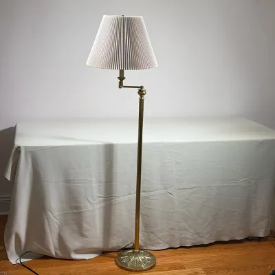 STIFFEL BRASS SWING-ARM FLOOR LAMP
The brass floor lamp features a fluted central column supported by a weighted circular base with a...