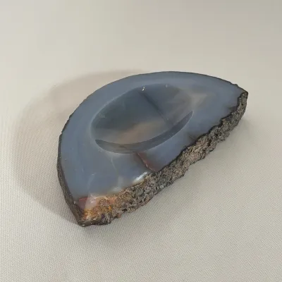 POLISHED BLUE AGATE CATCH-ALL BOWL
This semi-circular catch-all dish is crafted from a natural blue and grey banded agate with a polished...