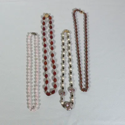 (4pc) FOUR ASSORTED BEADED SEMI-PRECIOUS STONE AND GLASS NECKLACES
This collection features four beaded necklaces including rose quartz,...