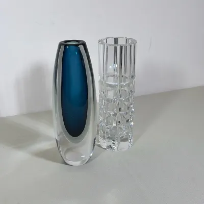VICKE LINDSTRAND FOR KOSTA SOMMERSO VASE AND ORREFORS CRYSTAL VASE
This lot features a Vicke Lindstrand sommerso art glass vase with a...