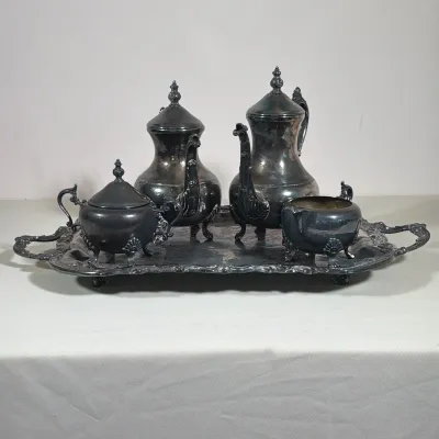 (5pc) F.B. ROGERS SILVER PLATE TEA AND COFFEE SERVICE WITH TRAY
This five-piece service includes a coffee pot, teapot, covered sugar...