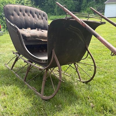 Sale Photo Thumbnail #4: Stored in a barn in Granby out of the weather for decades. Completely original condition,, very solid. Black body w/ red runners with pinstripes.