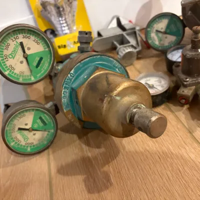 Sale Photo Thumbnail #306: 3 regulators, gear shift knob, small vise