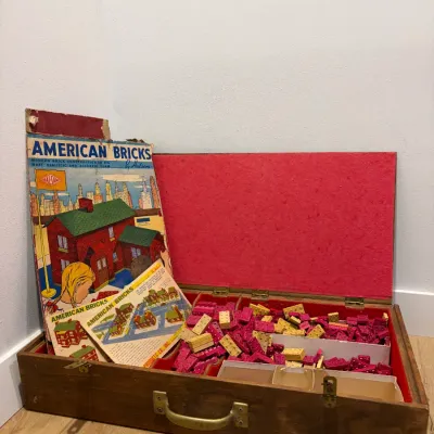 Sale Photo Thumbnail #9: Vintage wood pre-lego building blocks with paper roofs and advertising, storage box is older than bricks