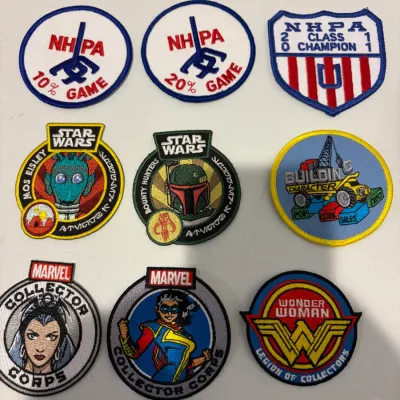 Sale Photo Thumbnail #245: Lot of various patches, pins, hide scraper, lighter, leather pouch
